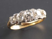 Lot 796 - A five stone diamond ring, the five graduating...