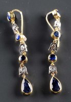 Lot 799 - A pair of sapphire and diamond earrings, of...