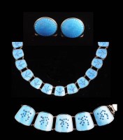 Lot 809 - An enamel and silver necklace, the tapering...