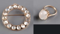 Lot 821 - A moonstone and gold brooch, c.1900, the...