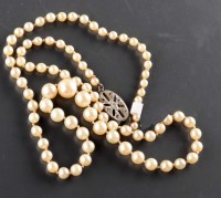 Lot 825 - A cultured pearl necklace, the slightly...