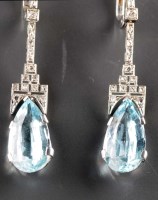 Lot 831 - A pair of aquamarine and diamond earrings in...