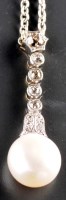 Lot 832 - A cultured pearl and diamond pendant, the...