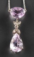 Lot 833 - A kunzite and diamond pendant, the pear-shaped...