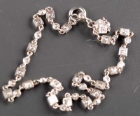 Lot 834 - A diamond bracelet composed of brilliant cut...