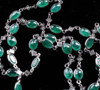 Lot 879 - An emerald and diamond necklace, the oval...