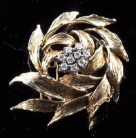 Lot 881 - A diamond and gold brooch modelled as a spray...