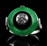 Lot 883 - A jade, onyx and diamond ring in the Art Deco...