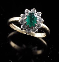 Lot 889 - RETURNED TO VENDOR An emerald and diamond ring,...