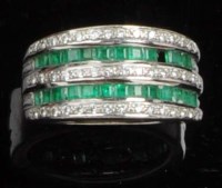 Lot 893 - An emerald and diamond ring, the three rows of...