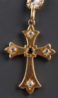 Lot 899 - A sapphire, diamond and gold pendant modelled...