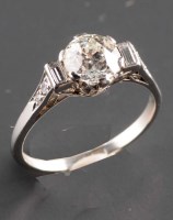 Lot 902 - A three-stone diamond ring, the central old...