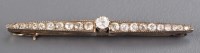 Lot 911 - A diamond bar brooch, c.1900, the principle...