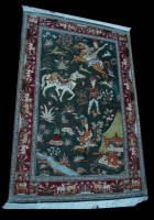 Lot 928 - A late 20th Century silk Persian rug, the...