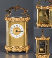 Lot 942 - An ornate brass carriage clock, with enamelled...