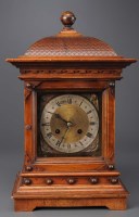 Lot 946 - A late 19th Century carved bracket clock, the...