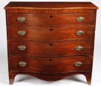 Lot 980 - A George IV serpentine mahogany chest of four...