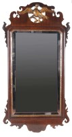 Lot 983 - A Georgian mahogany parcel gilt wall mirror...