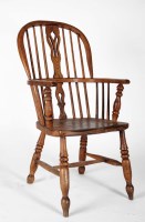 Lot 1005 - A 19th Century elm Windsor chair, with hooped...