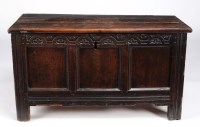 Lot 1012 - A late 17th Century panelled oak coffer with...