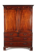 Lot 1020 - A George III mahogany linen press with a...