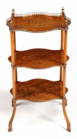 Lot 1028 - A small satinwood French style three-tier...