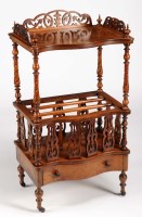 Lot 1034 - A Victorian walnut whatnot with serpentine...