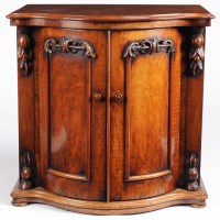 Lot 1035 - A Victorian walnut pedestal cupboard, the...