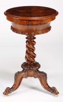 Lot 1040 - A Victorian circular walnut teapoy, with...