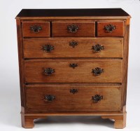 Lot 1045 - A Georgian mahogany chest of three short and...