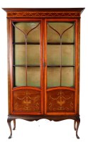 Lot 1059 - An Edwardian inlaid mahogany display cabinet...