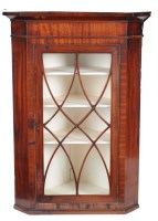 Lot 1061 - A 19th Century mahogany hanging corner cabinet...