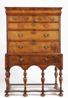 Lot 1074 - An 18th Century walnut chest on later stand,...