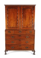 Lot 1080 - A mahogany linen press with a moulded cornice...