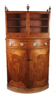 Lot 1096 - A Georgian mahogany bowfront cupboard with...