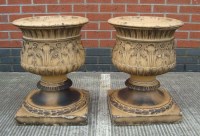 Lot 1120 - A pair of ware garden urns, in terracotta...