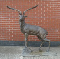 Lot 1127 - A cast metal stag, late 20th Century, standing...