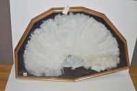 Lot 323 - A white ostrich feather fan, mother-of-pearl...