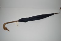 Lot 392 - An early 20th Century Brigg parasol, navy silk...