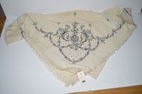 Lot 394 - An early 20th Century cream wool shawl, with...