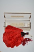 Lot 396 - A red ostrich feather and tortoiseshell stick...