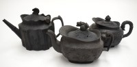 Lot 101 - Three basalt teapots, to include: attributed...