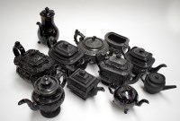Lot 112 - Mainly black glazed tea and coffee pots; and a...