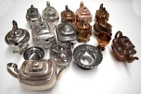Lot 113 - Silver and copper lustre earthenware teapots;...