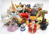 Lot 127 - A collection of 20th Century novelty teapots,...