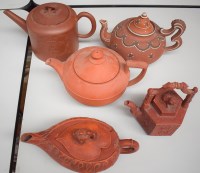 Lot 132 - Five Chinese and similar earthenware teapots.