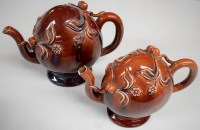 Lot 137 - Two Mortlach Cadogen teapots, in brown glaze,...