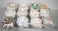 Lot 143 - Twelve Old English style porcelain teapots,...