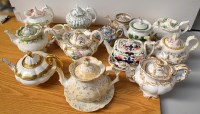 Lot 145 - Fourteen 19th Century teapots, two on stands,...
