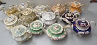 Lot 164 - Twelve footed teapots, one with covered sugar,...